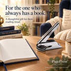 Silver PagePress embosser beside an embossed book in a reading nook, presented as a book-lover gift idea.